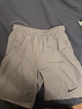 Nike Light Beige Athletic Shorts with Black Swoosh